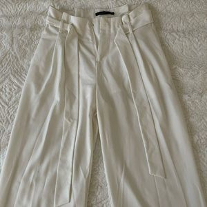 High waisted, wide legs white pants.